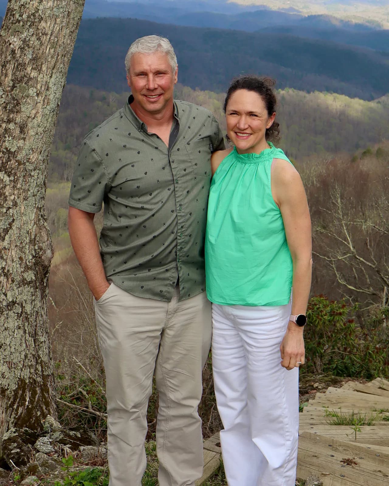 Dave and Lindsey Calverley, founders of Elevate Building Company, standing at a Blue Ridge Mountain overlook