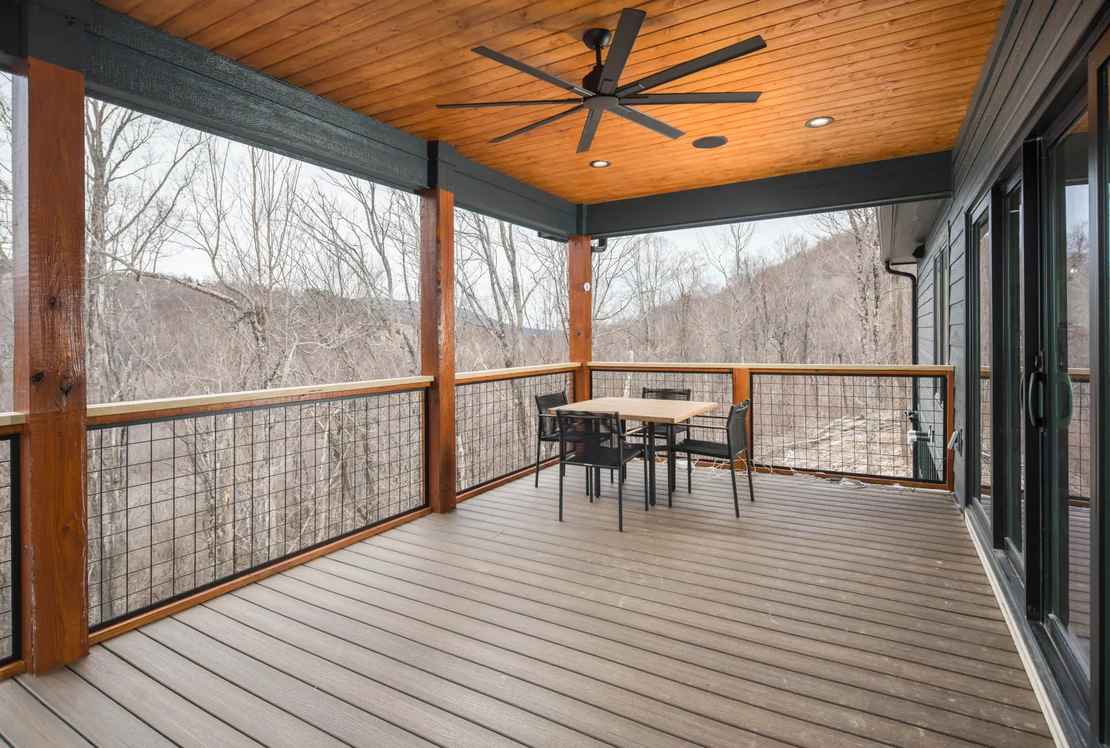 Covered porch with tongue-and-groove wood ceiling overlooking the Blue Ridge Mountains